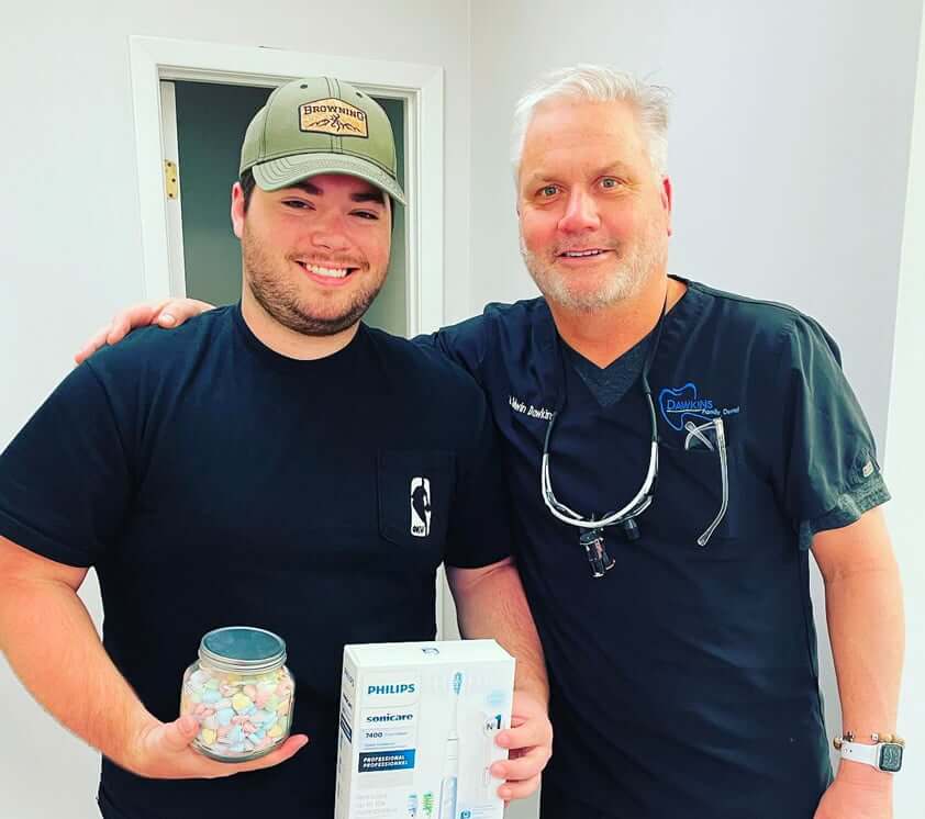 Dr. Dawkins and a smiling patient