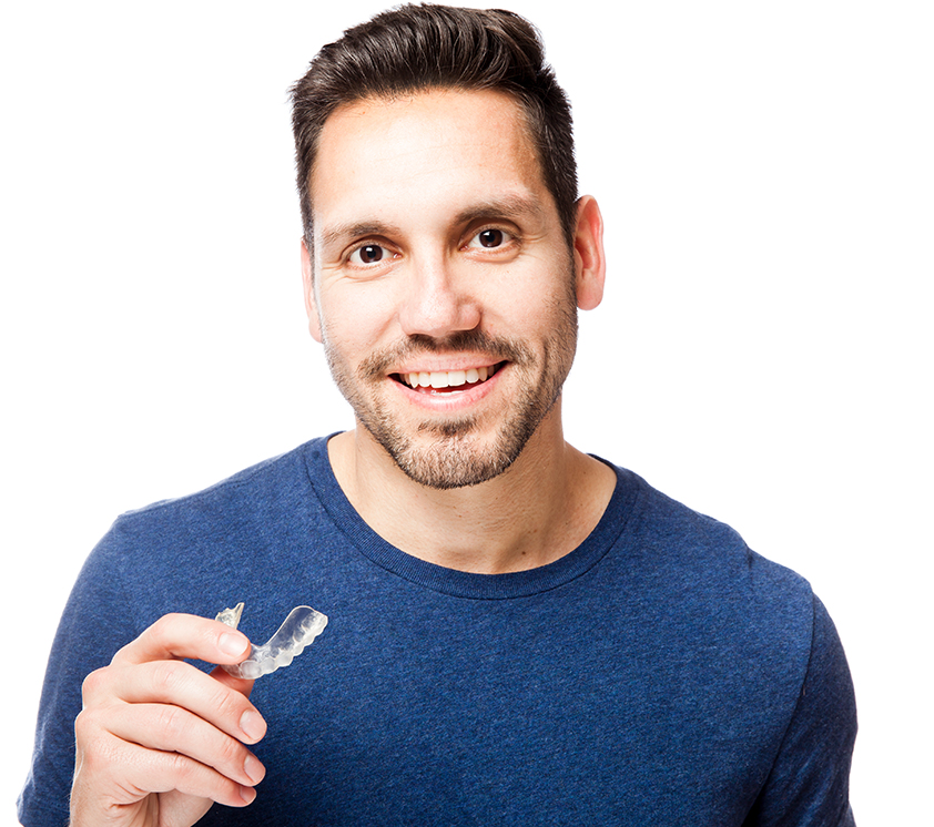 man holding clear aligner