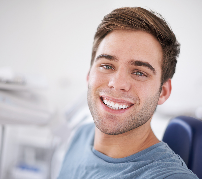 man smiling at dentist